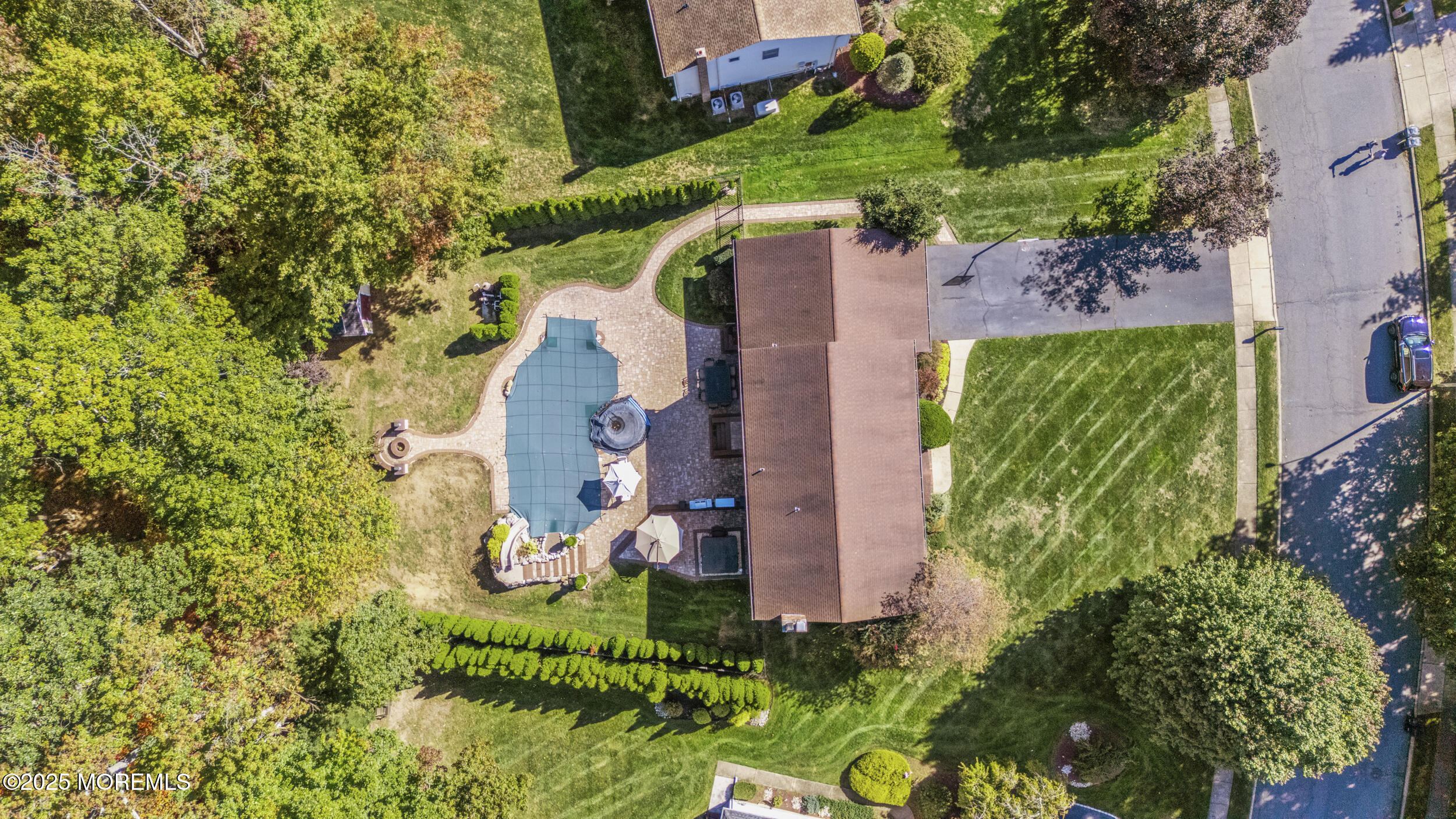 16 Timber Lane Manalapan, NJ 07726 - Photo 40 of 54 an aerial view of a house with a yard and garden