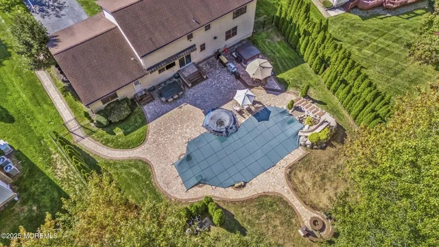 an outdoor space with patio and white umbrellas