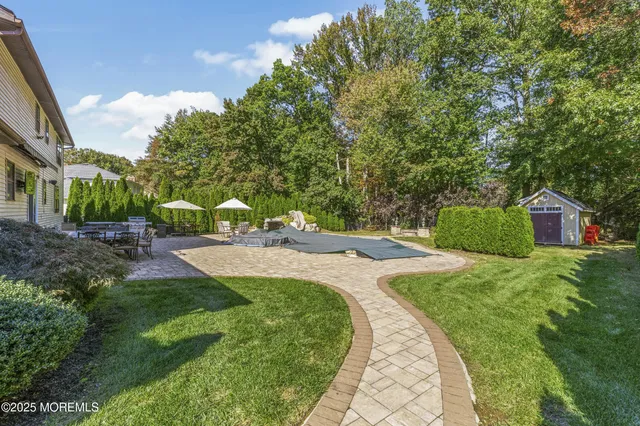 a roof deck view with table and chairs