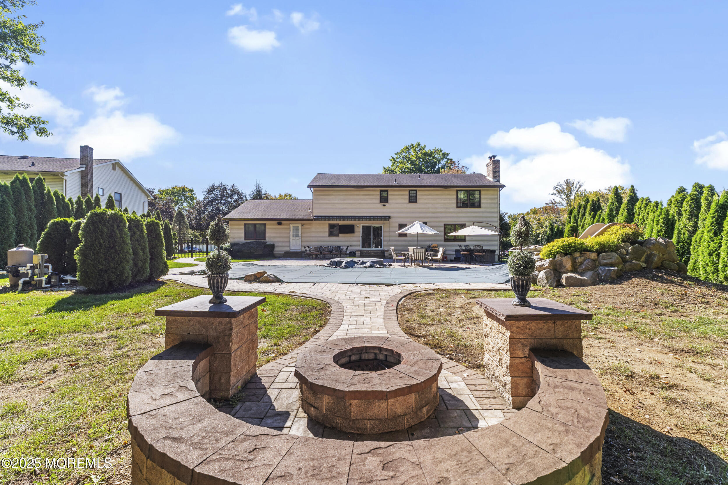 16 Timber Lane Manalapan, NJ 07726 - Photo 50 of 54 a view of a patio with couches chairs and a potted plant