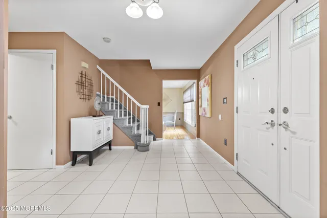 a view of an entryway with wooden floor