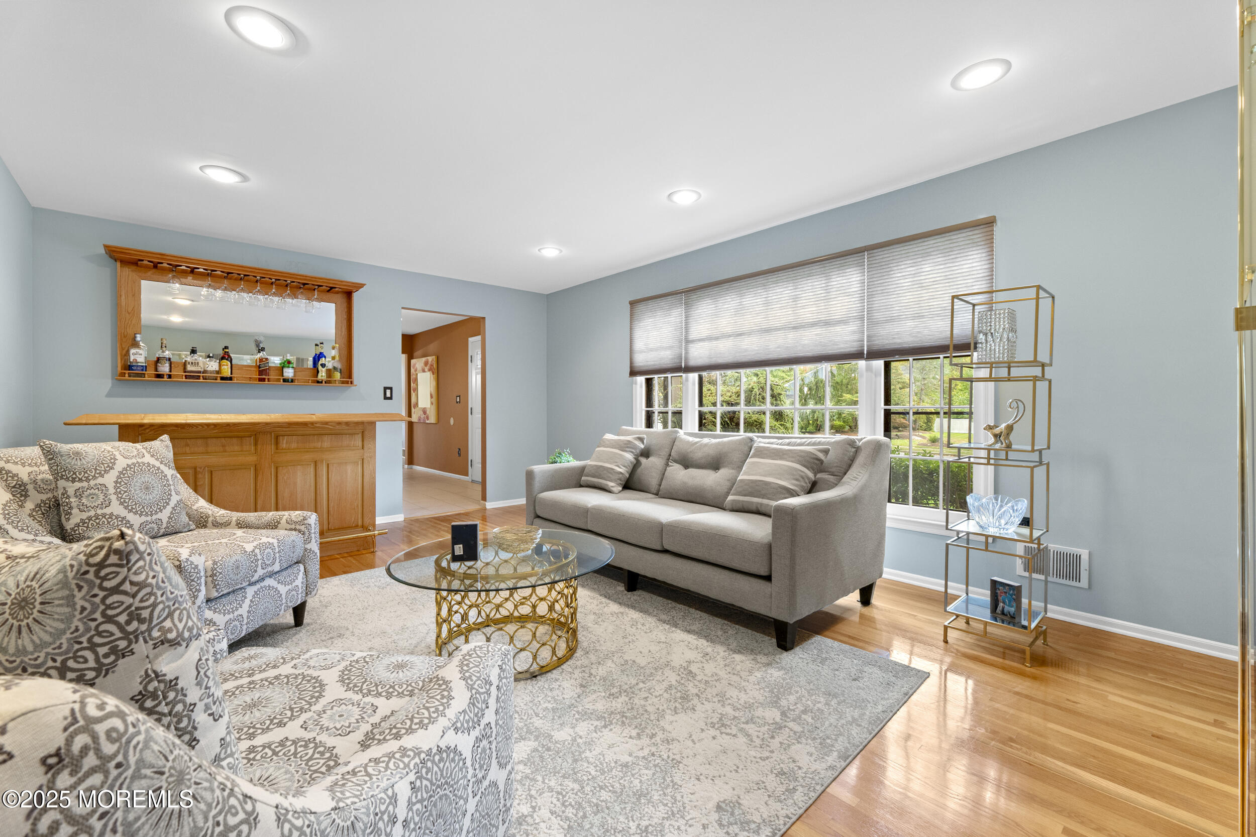 16 Timber Lane Manalapan, NJ 07726 - Photo 7 of 54 a living room with furniture and a flat screen tv