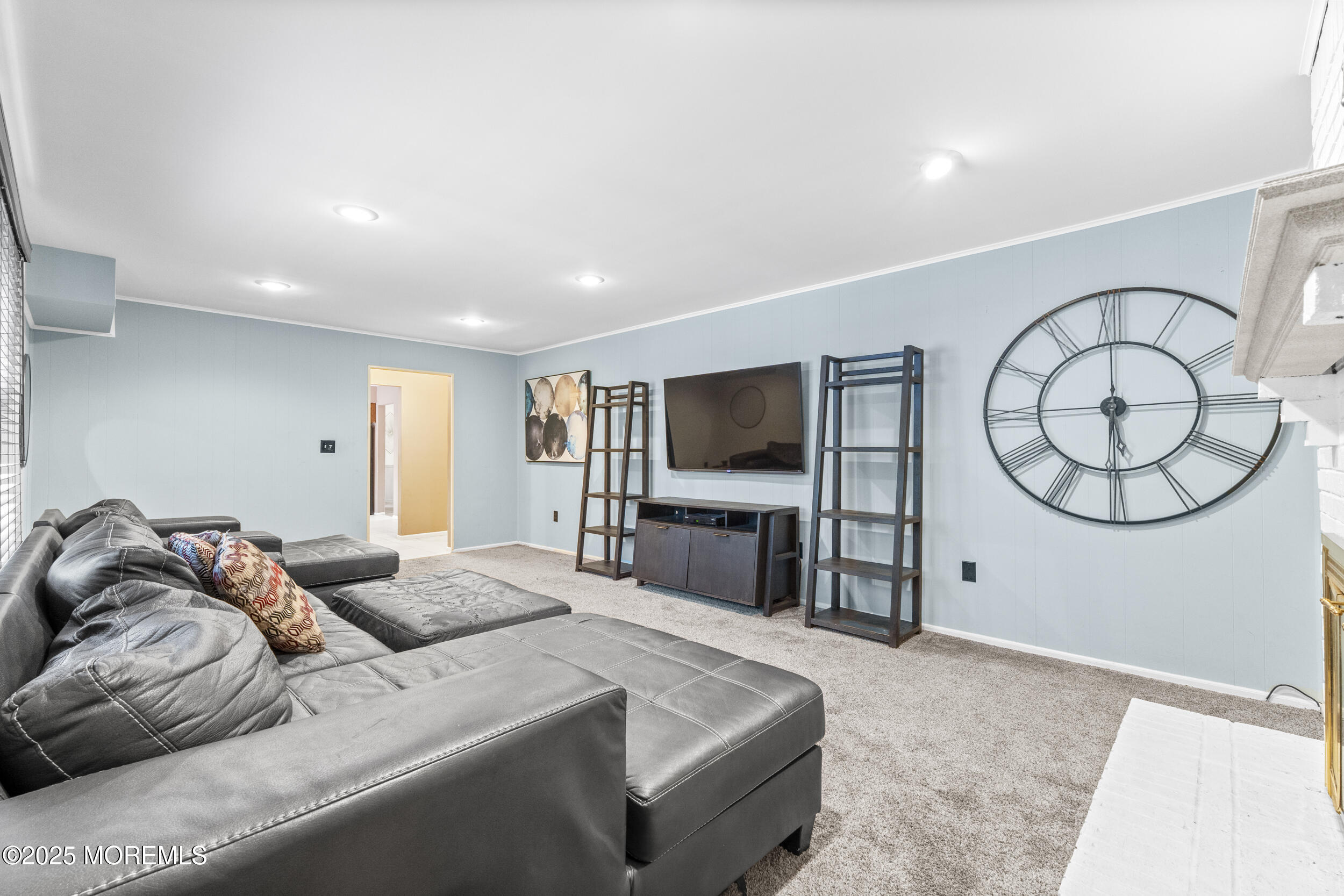 16 Timber Lane Manalapan, NJ 07726 - Photo 10 of 54 a living room with furniture and a flat screen tv