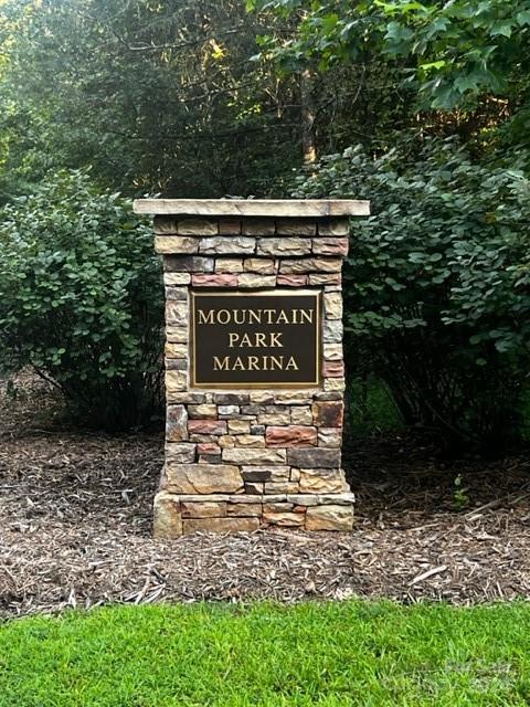 23 Mountain Parkway Mill Spring, NC 28756 - Photo 11 of 15 a sign that is sitting on the side of a road