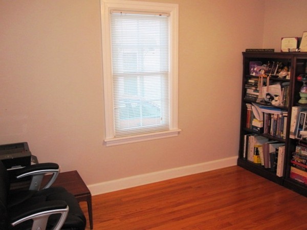 322 Abbott Street Springfield, MA 01118 - Photo 11 of 11 a view of a workspace with furniture and wooden floor