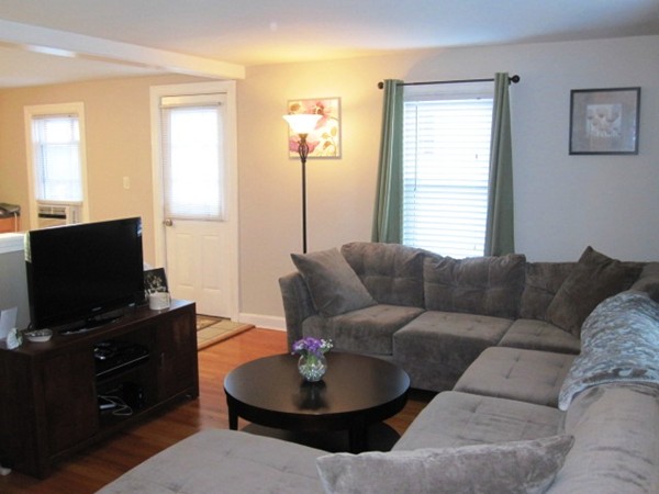 322 Abbott Street Springfield, MA 01118 - Photo 3 of 11 a living room with furniture a flat screen tv and a window
