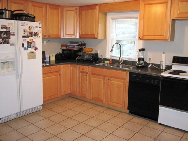 322 Abbott Street Springfield, MA 01118 - Photo 4 of 11 a kitchen with stainless steel appliances granite countertop a refrigerator and a sink