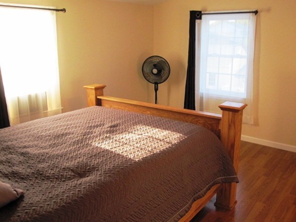 322 Abbott Street Springfield, MA 01118 - Photo 7 of 11 a bedroom with a bed and a window
