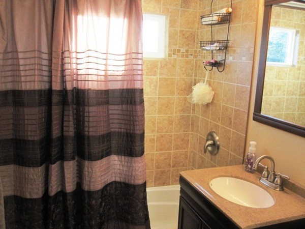 322 Abbott Street Springfield, MA 01118 - Photo 8 of 11 a bathroom with a sink and a mirror