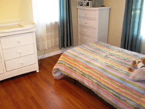 322 Abbott Street Springfield, MA 01118 - Photo 9 of 11 a bedroom with a bed and cabinet
