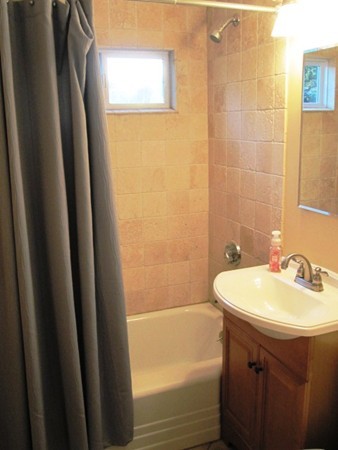 322 Abbott Street Springfield, MA 01118 - Photo 10 of 11 a bathroom with a sink and a mirror