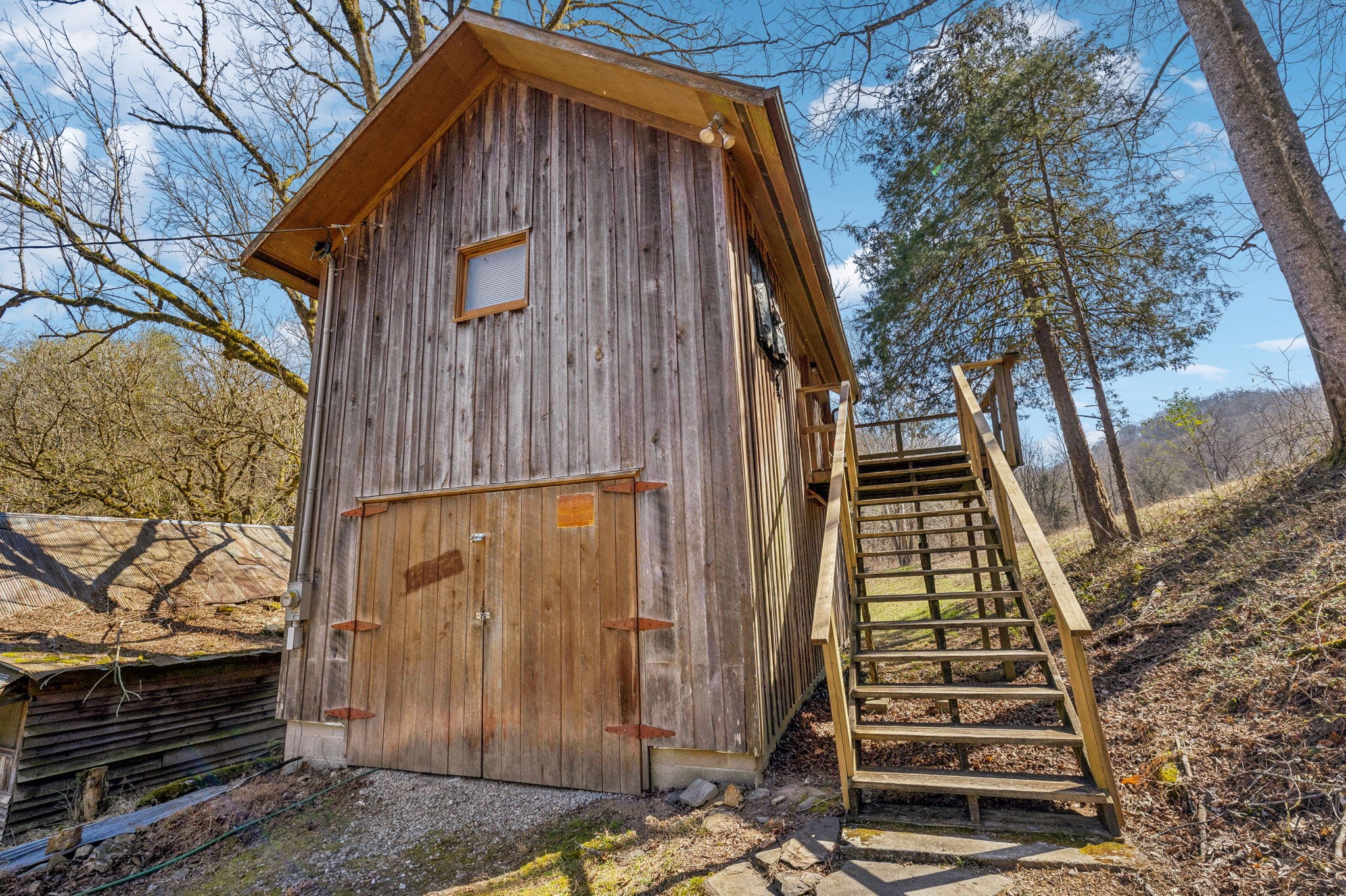 6528 Neeley Creek Road Celina, TN 38551 - Photo 13 of 61 a yellow house with trees in front of it