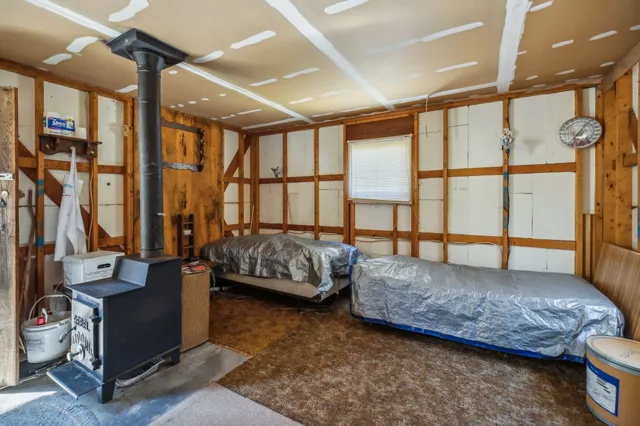 a view of a house with a yard and covered with snow