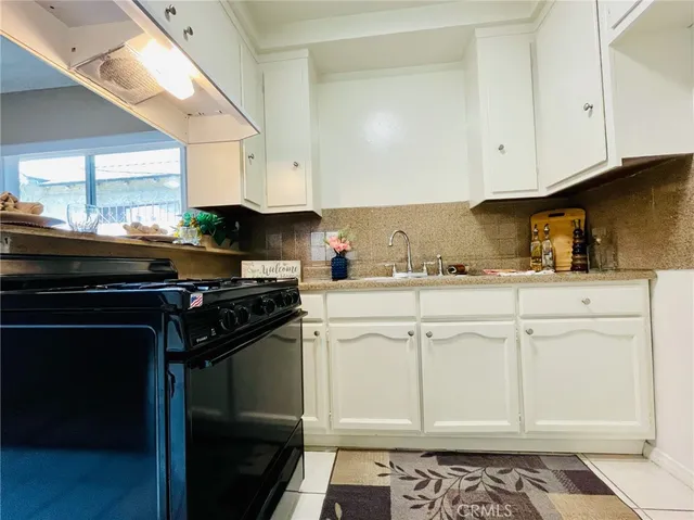 a kitchen with cabinets and appliances