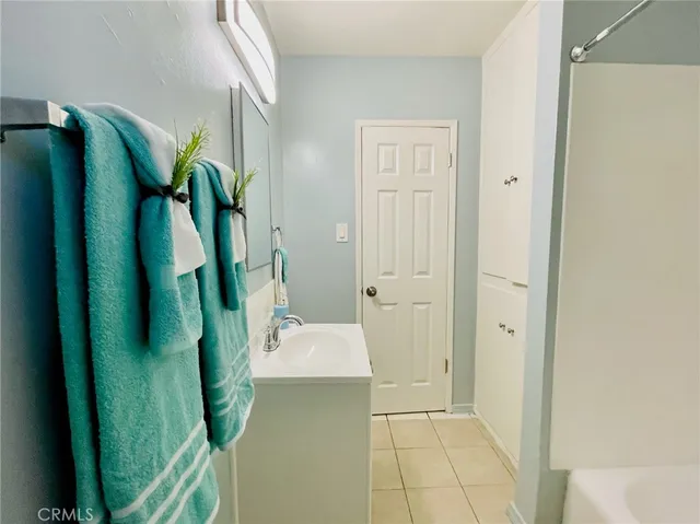 a bathroom with a sink a mirror and a toilet