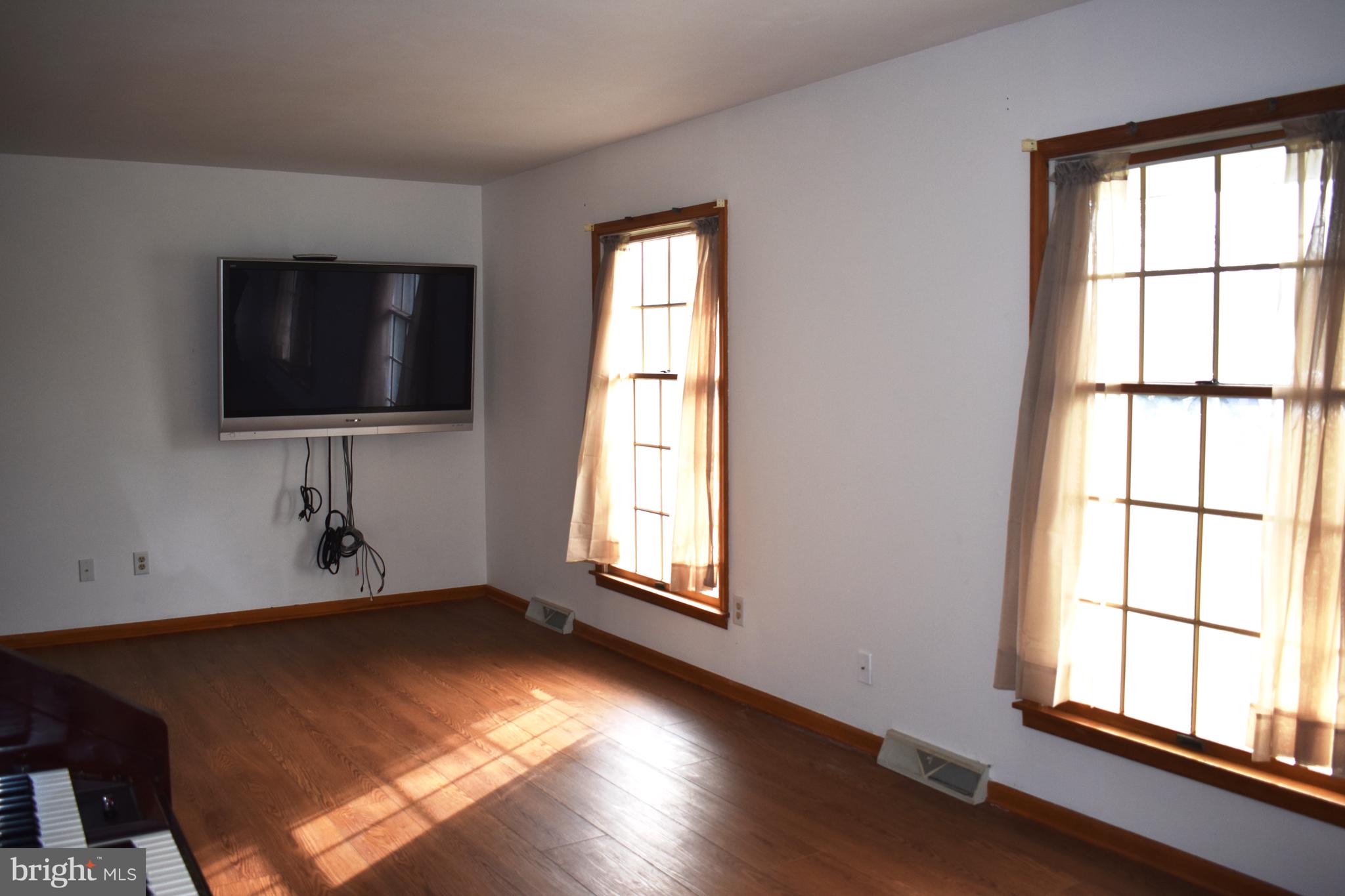477 Barratts Chapel Road Felton, DE 19943 - Photo 2 of 26 Living room with laminate wood plank flooring