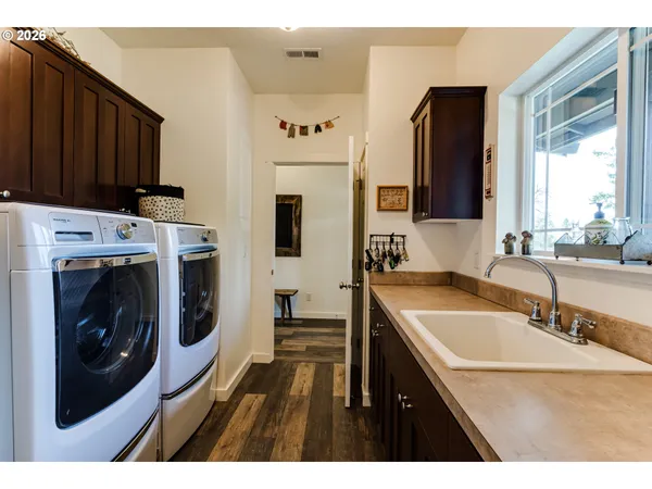 a kitchen with a sink stove and microwave