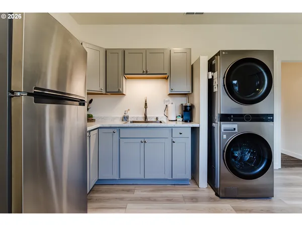 a view of a kitchen with washer and dryer