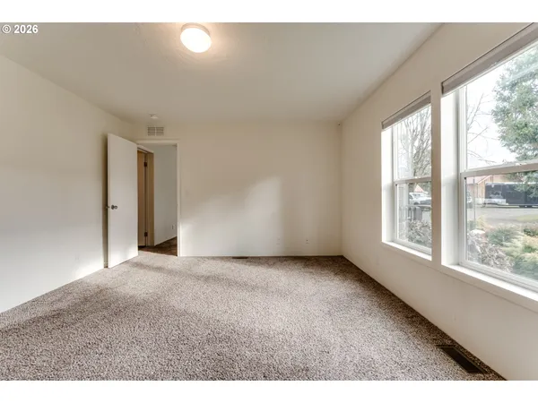 a bathroom with a sink a mirror a shower and vanity