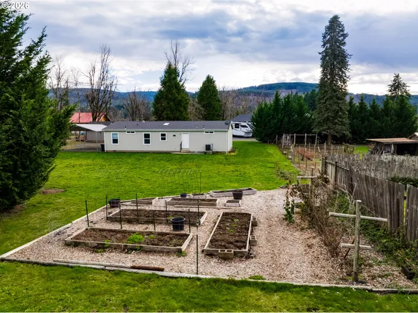 a view of a garden with houses