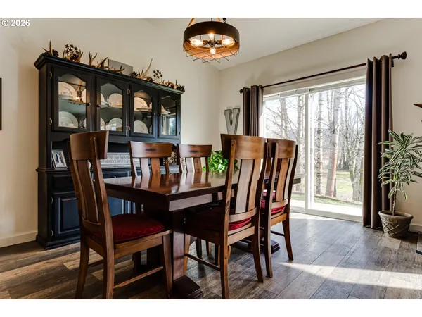 a dining room with furniture and window