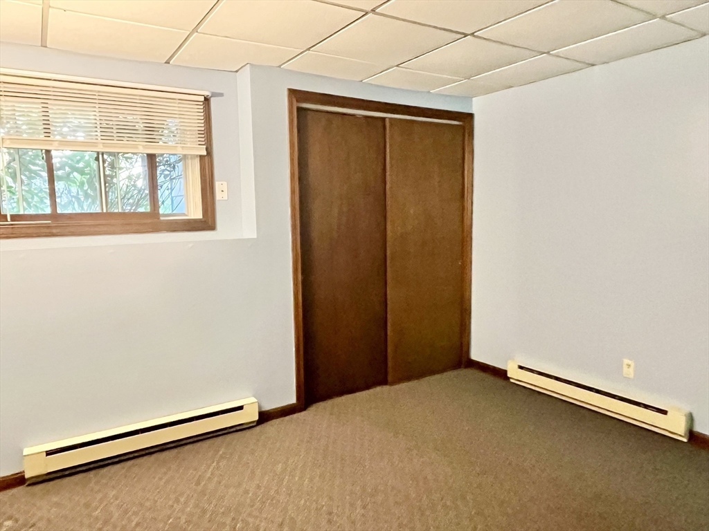 15 Old County Road Holland, MA 01521 - Photo 11 of 22 a view of an empty room with a window