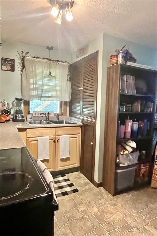 15 Old County Road Holland, MA 01521 - Photo 14 of 22 a kitchen with stainless steel appliances granite countertop a sink stove and cabinets