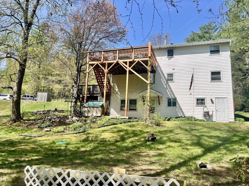 15 Old County Road Holland, MA 01521 - Photo 19 of 22 a view of a house with backyard
