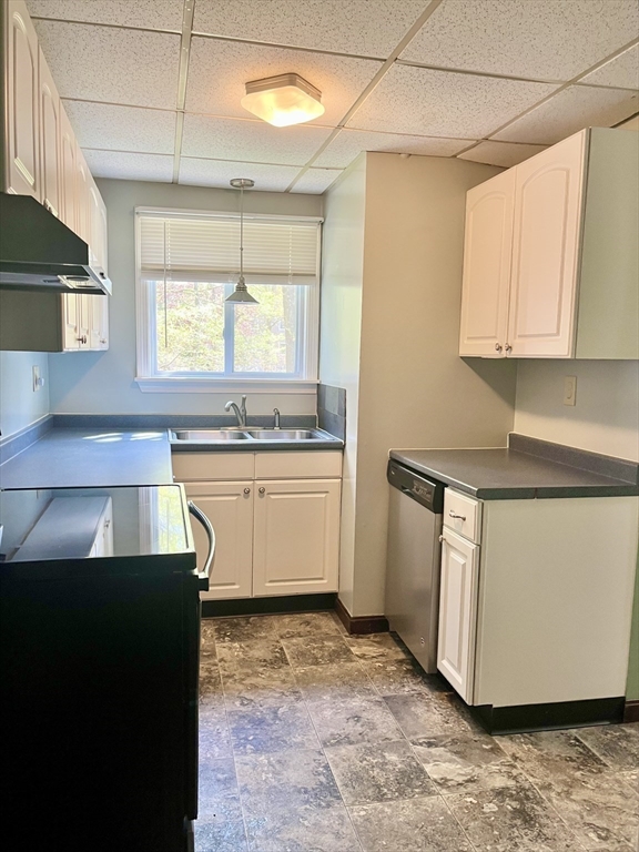 15 Old County Road Holland, MA 01521 - Photo 8 of 22 a kitchen with a sink stove and cabinets
