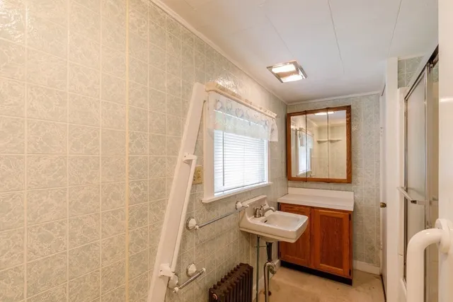 a bathroom with a sink a toilet and a bathtub