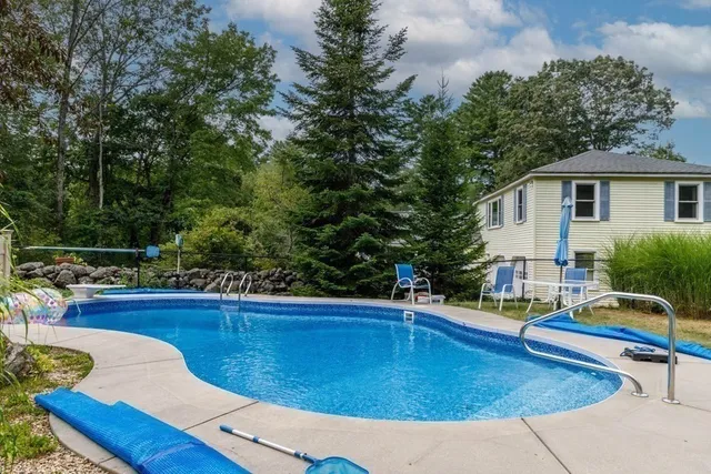 a view of a swimming pool with a lounge chair