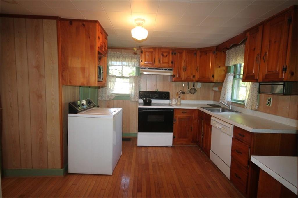 350 Ocean Point Road East Boothbay, ME 04544 - Photo 10 of 22 The kitchen with wood cabinets and...