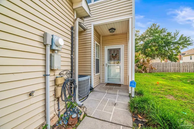 a view of a door with a bench and floor to ceiling window