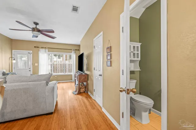 a spacious bathroom with a bathtub and a toilet