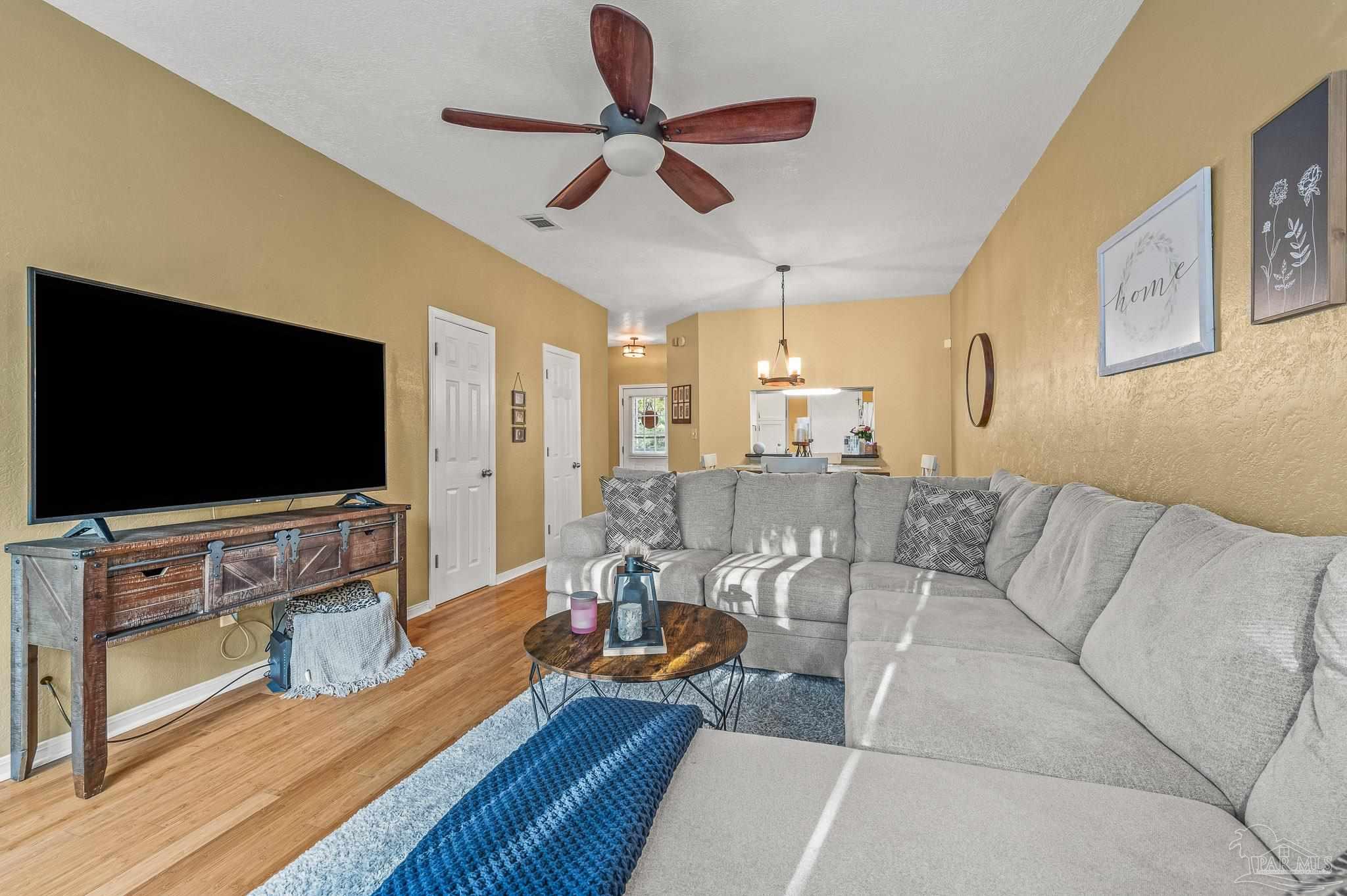 601 East Burgess Road, Unit K1 Pensacola, FL 32504 - Photo 20 of 41 a living room with furniture and a flat screen tv