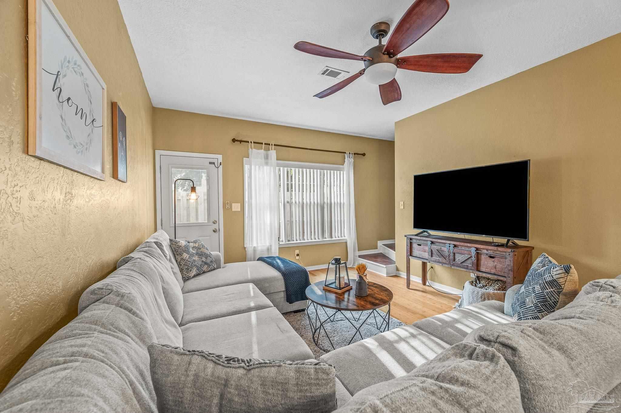 601 East Burgess Road, Unit K1 Pensacola, FL 32504 - Photo 22 of 41 a living room with furniture and a flat screen tv
