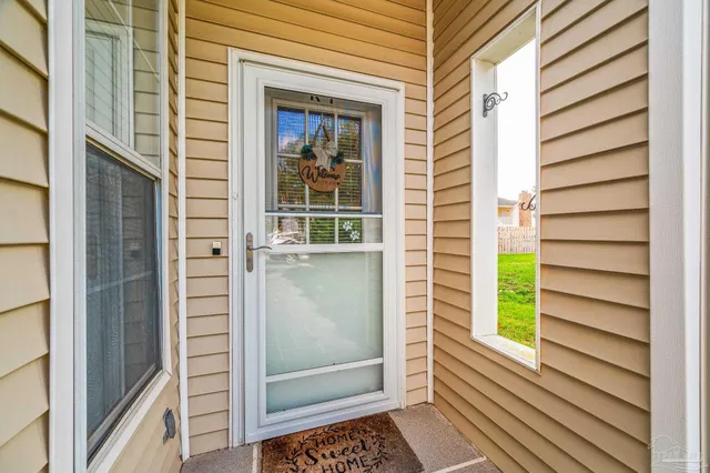 a view of a door and a window