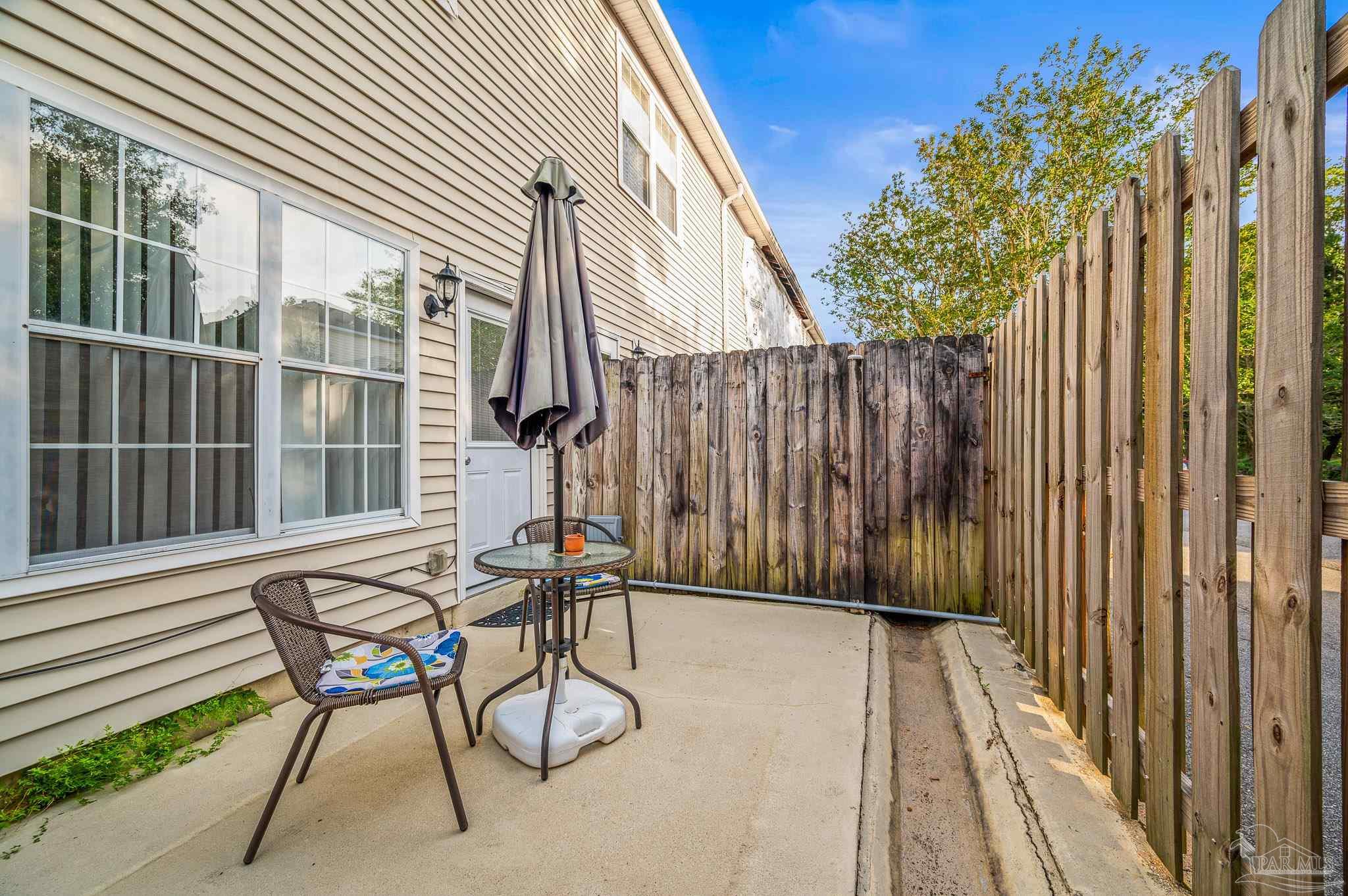 601 East Burgess Road, Unit K1 Pensacola, FL 32504 - Photo 38 of 41 a view of chair and table in the balcony