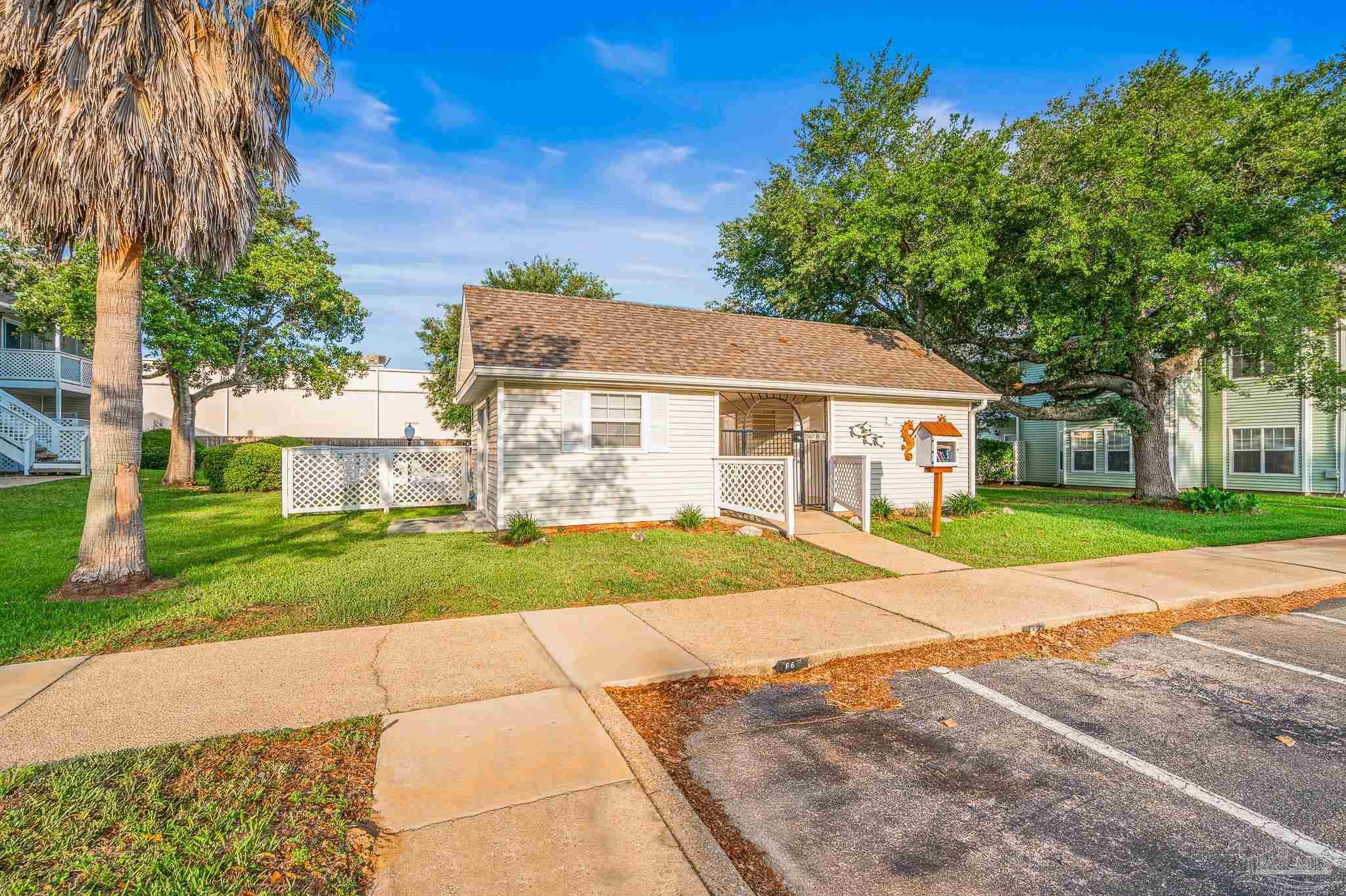 601 East Burgess Road, Unit K1 Pensacola, FL 32504 - Photo 39 of 41 a aerial view of a house next to a yard with big trees