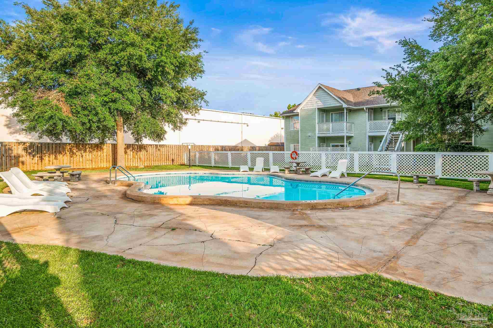 601 East Burgess Road, Unit K1 Pensacola, FL 32504 - Photo 40 of 41 a view of outdoor space yard and swimming pool