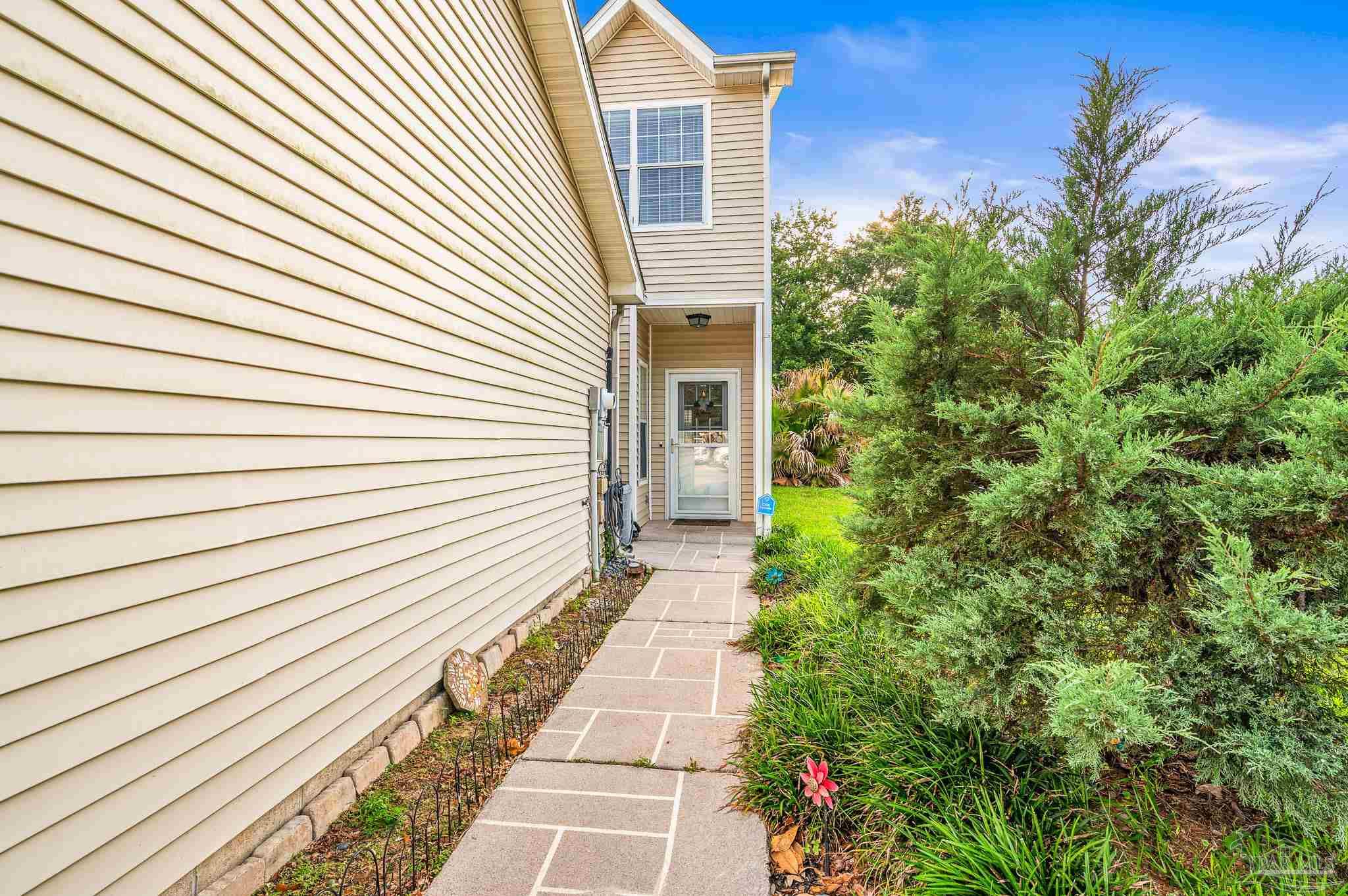 601 East Burgess Road, Unit K1 Pensacola, FL 32504 - Photo 41 of 41 a view of a pathway with a house in the background