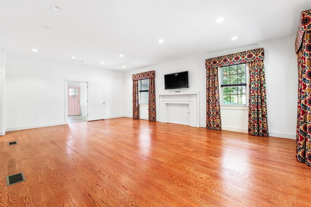 62 Old River Place Dedham, MA 02026 - Photo 17 of 39 a view of empty room with wooden floor and window