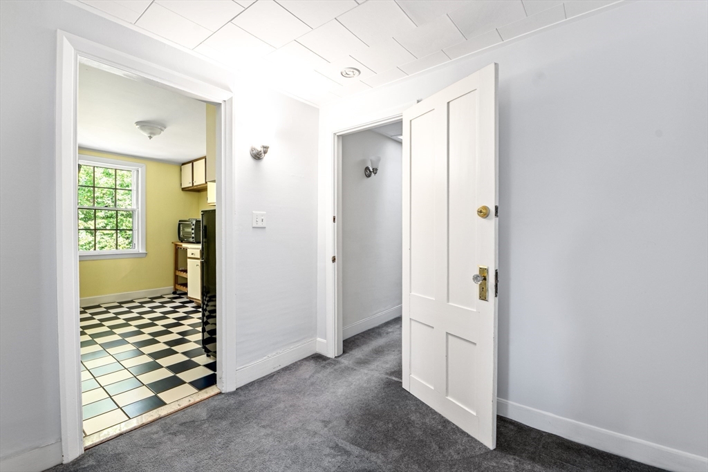 62 Old River Place Dedham, MA 02026 - Photo 33 of 39 a view of a hallway with bathroom and wooden floor