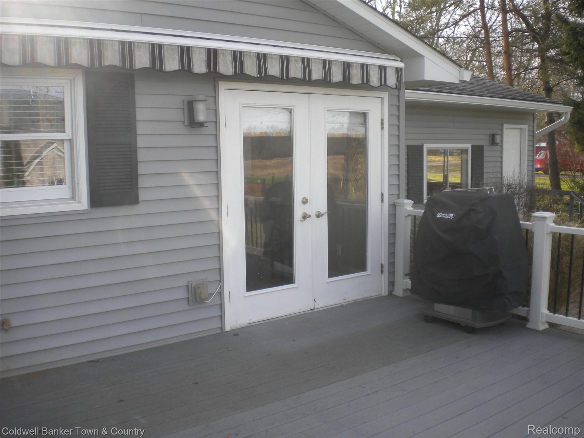 858 Henderson Road Howell, MI 48855 - Photo 44 of 50 Deck With Awning 858 Henderson Rd Howell Mi 48855