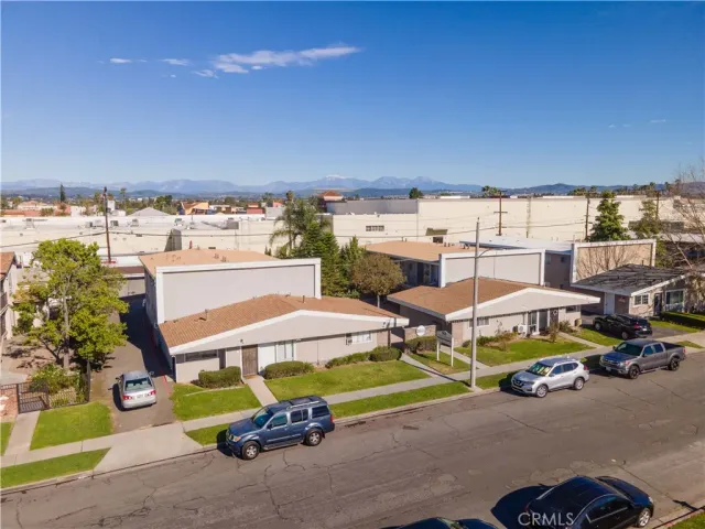 a view of a patio with table and chairs