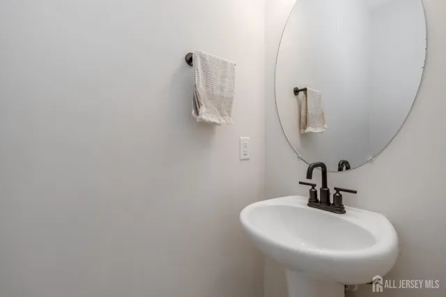 a bathroom with a sink and mirror