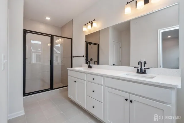 a bathroom with a sink and mirror