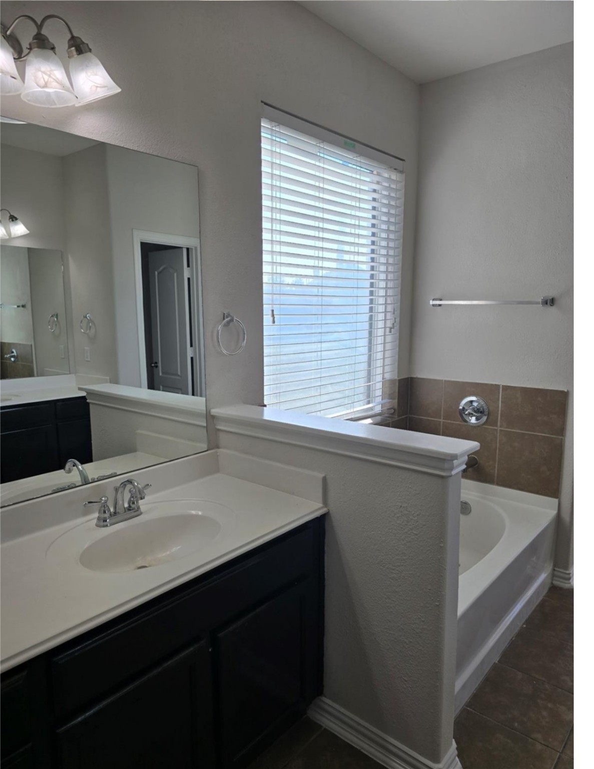 9702 Layton Ridge Drive Humble, TX 77396 - Photo 11 of 21 a bathroom with a sink and a bathtub