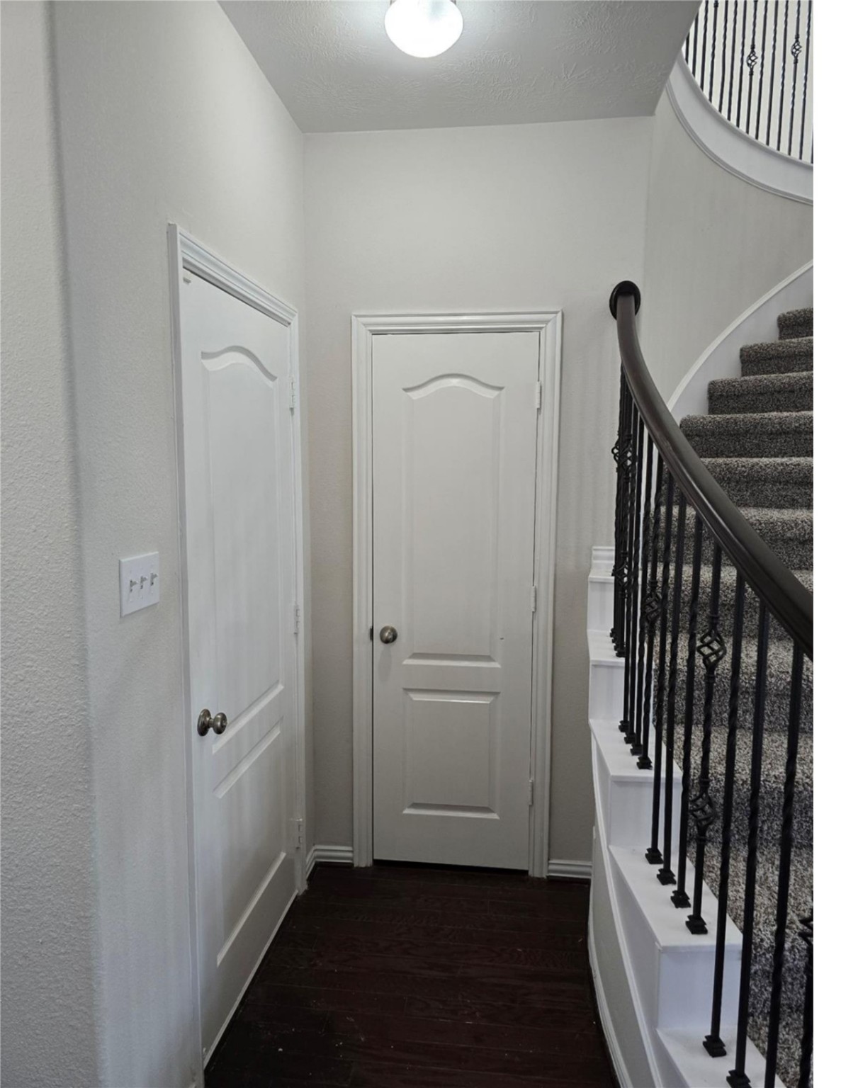 9702 Layton Ridge Drive Humble, TX 77396 - Photo 17 of 21 a view of a hallway with wooden floor and staircase