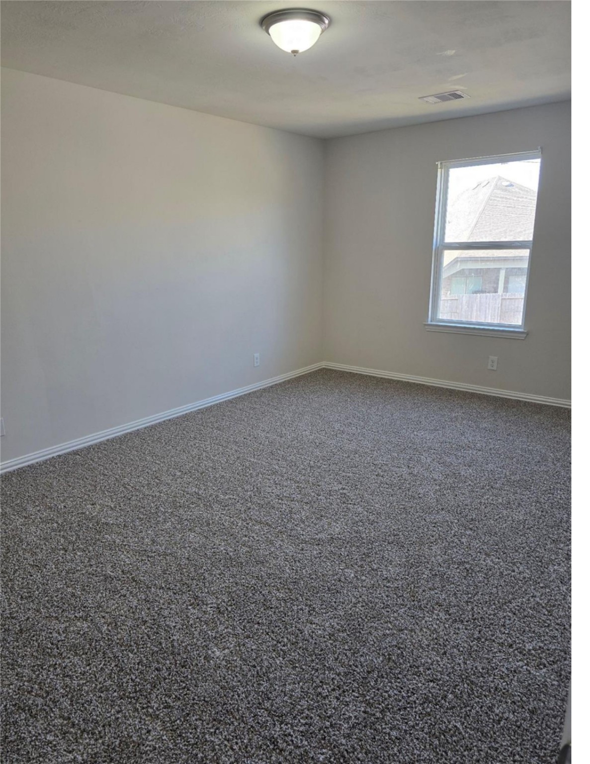 9702 Layton Ridge Drive Humble, TX 77396 - Photo 3 of 21 an empty room with a window